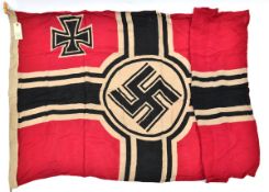 A Third Reich Reichskriegsflagge, the hoist stamped with eagle and swastika over “M”, date “1939”,