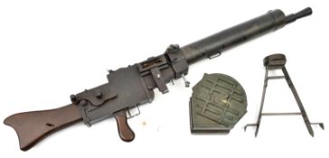 A wood and metal film prop replica of a WWI German MG08 machine gun, with bi-pod stand and drum