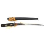 A Japanese sword wakizashi, blade 33.5cms, mumei, pierced iron mokko tsuba, in a black lacquered