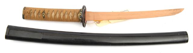 The koshirae (fittings) for a Japanese sword wakizashi, wooden “blade” 25cms, pierced iron mokko