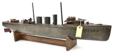 A wood and metal pond model of a pre WWI naval gun boat, 36” overall, with one round and 2 ovoid