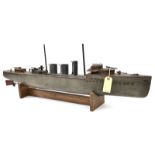 A wood and metal pond model of a pre WWI naval gun boat, 36” overall, with one round and 2 ovoid