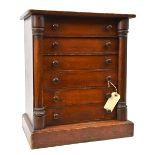A collector’s wooden cabinet, of 6 drawers, 12” x 7” x 1¼” (internal), swivel columns to sides,
