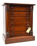 A collector’s wooden cabinet, of 6 drawers, 12” x 7” x 1¼” (internal), swivel columns to sides,