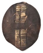 A small Swazi ovoid dark hide shield, slotted central bands, 22” x 18”. GC