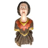 A 19th century Ship’s painted figurehead, in the form of a young woman, torso length, staring
