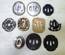 10 assorted iron or brass tsuba, comprising 5 castings, 1 shingunto, 1 kyugunto, 2 of tsuba type,