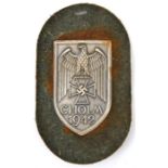 A Third Reich Cholm shield, of WM on field grey felt patch with steel backing plate and remains of