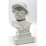 A c 1930s period white porcelain bust of a German soldier, wearing WWI pattern steel helmet,