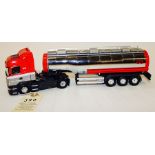 A Dutch Tekno Scania R420 6-wheeled tractor unit and 6 wheeled tanker trailer. In Gert Jacobsen red,