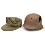 A Third Reich coarse linen camouflaged ski cap, the inside of the crown stamped with RB number and