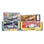 2 Corgi James Bond Aston Martin (271). Silver bodies with red interior. Both boxed with header cards