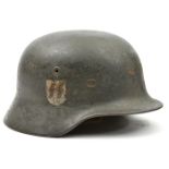 A Third Reich M40 double decal steel helmet, with dark grey/green painted finish (signs of more than