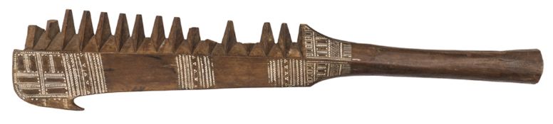 A 19th century Oceanic Islands brown wood paddle club, of flattened diamond section, the head with