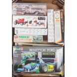 A quantity of unmade plastic model motor racing kits. By Lindberg, Revell, Heller, Monogram, Riko,