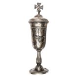 A German silver plated cup, height 13½” including lid, the body of the cup having superimposed metal