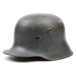 A 1918 pattern German steel helmet, with dark grey finish and later leather liner with top pad (