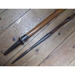 A pair of bamboo cavalry lances, leather hand grips to centre. GC