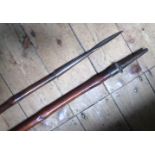 A pair of bamboo cavalry lances, leather hand grips to centre. GC