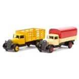 2 Dinky Toys 25 series 4th type lorries. A Covered Wagon (25b) in cream with red tilt and wheels,