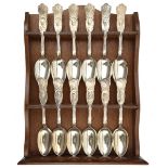 A WWI commemorative set of 12 silver plated spoons (6” length) depicting the leaders of Armed Forces