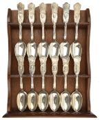 A WWI commemorative set of 12 silver plated spoons (6” length) depicting the leaders of Armed Forces