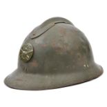 A French “Adrian” pattern steel helmet, stamped disc with “RF” grenade on crossed cannon, leather