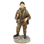 An Ashmor Falklands commemorative painted porcelain figure of a R. Marine, 40, 42 and 45 Commando,