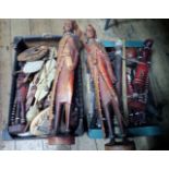 A large quantity of African tourist souvenir painted wooden figures (Masai?), ebony busts,