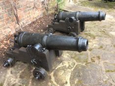A pair of early 19th century 6 pounder iron Carronades, 43” overall, breeches embossed with a