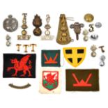 4 shoulder titles: brass Welsh Horse (Westlake 361), T/6 and T/7/ grenade/ RWF and WM 2/ V/ grenade/