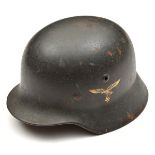 A Third Reich Luftwaffe double decal M40 steel helmet, the dark grey/black painted skull with