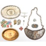 A small oval brass tray, stamped with an eagle and swastika and “Offizierheim/ Berlin 12”; a