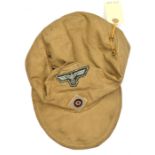 A Third Reich Army tropical ski cap, the white on green eagle with zig zag stitching, the cockade on