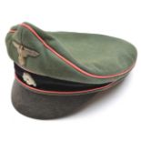 A Third Reich “old style” SS Panzer officer’s peaked cap, with soft leather peak, black velvet band,