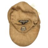 A Third Reich M43 SS floppy ski cap, buff coloured with machine woven insignia and buff lining.