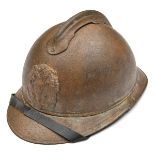 A WWI Imperial Russian Adrian pattern steel helmet, with khaki/brown painted skull and badge, and
