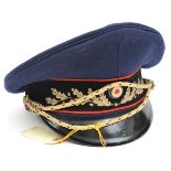 A Third Reich Railway leader’s peaked cap, with blue crown, black velvet band with red piping, metal