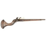 A decorative Indian bazaar flintlock gun, the cut down 21½” octagonal barrel from a torador,
