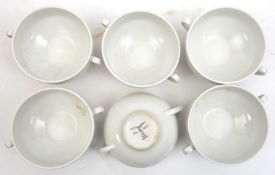 6 Third Reich white china Luftwaffe soup bowls, the bases marked with Luftwaffe eagle and “Fl- U.
