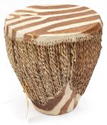 A small African drum, scratch decorated wooden body, brown hide ends, 12” diam 8” (some wear and