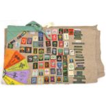 An interesting Scouts grey wool blanket, folded and embellished with approx 250 cloth insignia of