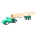 A scarce Danish Volvo normal control articulated timber lorry. Cab in light green with dark green