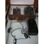 A scarce WWII Morse code set, comprising 2 head sets, bakelite key Type D, Morse tapper, an Ericsson