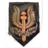 A WWII cloth badge of the Special Air Service, early large size, 2½” x 1¾”. GC