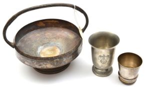 A silver plated cup, 3” high, the base stamped with eagle and swastika; a footed pewter cup, 4½”,