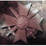 A Third Reich War Merit Cross 1st class with swords, with scarce screw and disc fitting. GC (screw