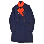 An Imperial German officer’s three quarter length tail coat, of Prussian blue with red stand up