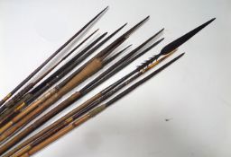 12 various fishing spears, on bamboo hafts, average 4’ overall. GC