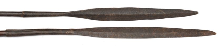 2 African spears, slender leaf shaped blades on darkwood hafts with pointed iron shoes, 53” x 51”